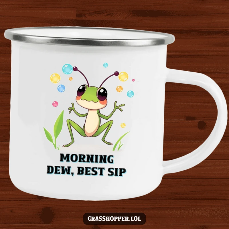 Funny enamel camping mug featuring a grasshopper gleefully juggling colorful dewdrops, great for outdoor fun and funny gifts.