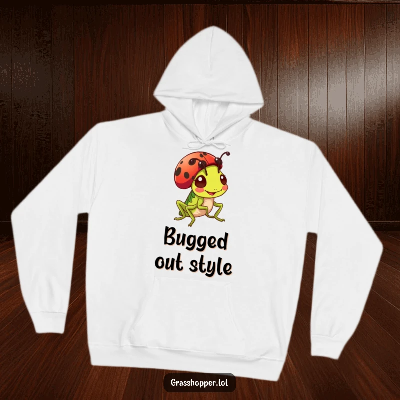 Funny cheerful grasshopper sporting a ladybug as a jaunty hat on a cozy hoodie, warm and cute design.