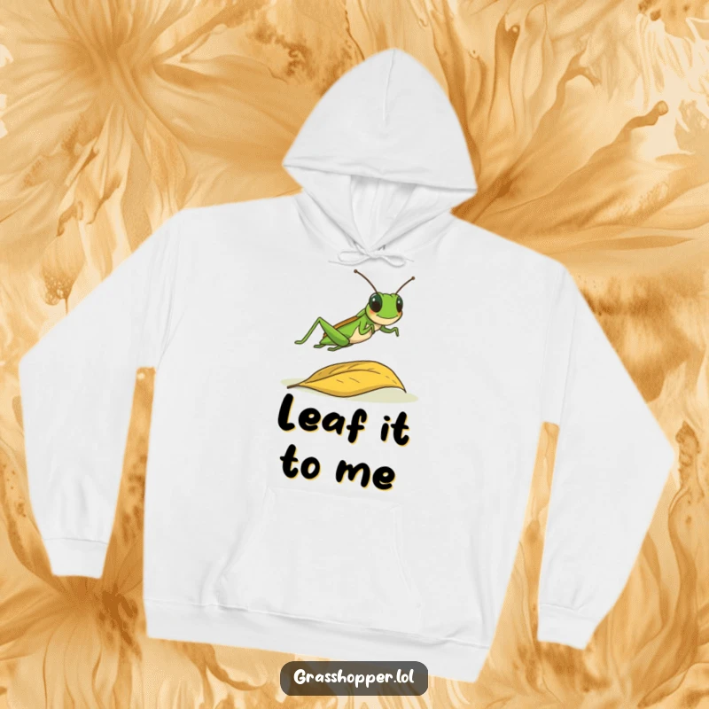 Funny grasshopper joyfully leaping over a fallen leaf, depicted on a warm and cozy hoodie, active design.