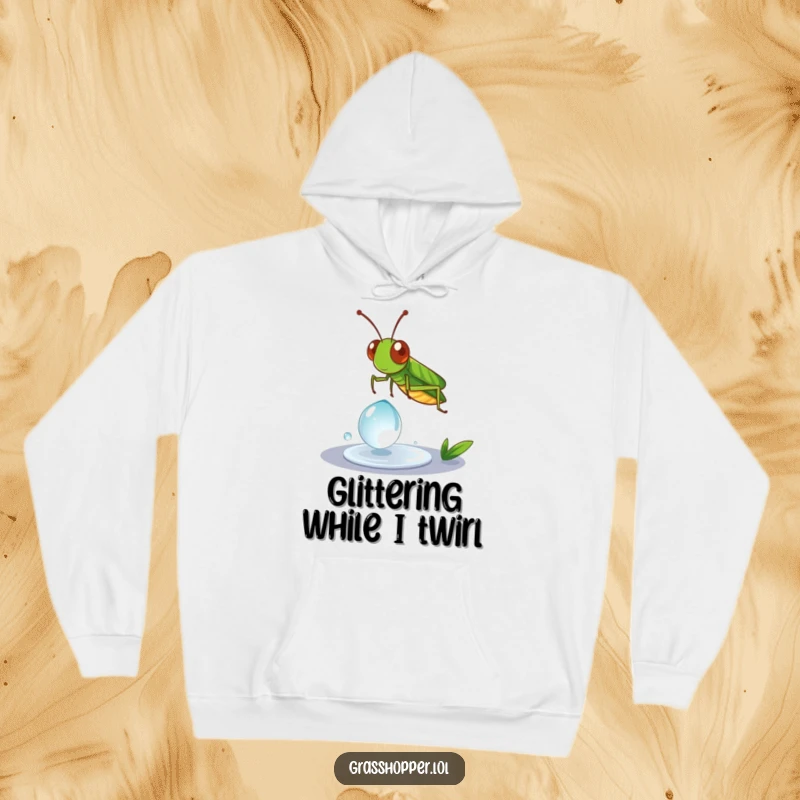 Funny Grasshopper Hoodie depicting a grasshopper in a playful spin on a dewdrop, ideal for cozy wear.