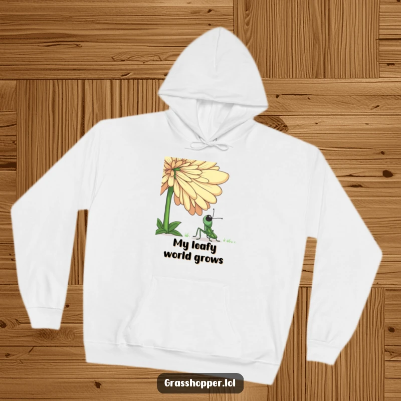 Funny grasshopper hoodie featuring an adorable insect marveling at a gigantic, blooming flower, conveying a sense of innocent fascination.