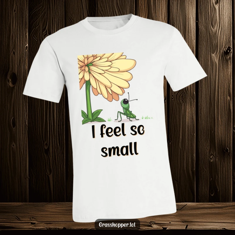 Funny grasshopper t-shirt showing a small insect looking up in pure amazement at an enormous, colorful flower, capturing a moment of awe.